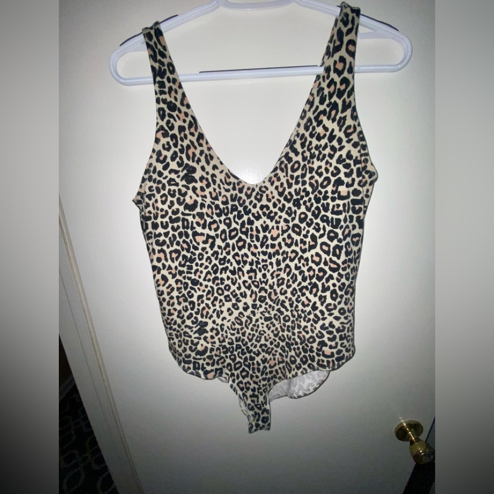 Excellent used condition, cheetah bodysuit.